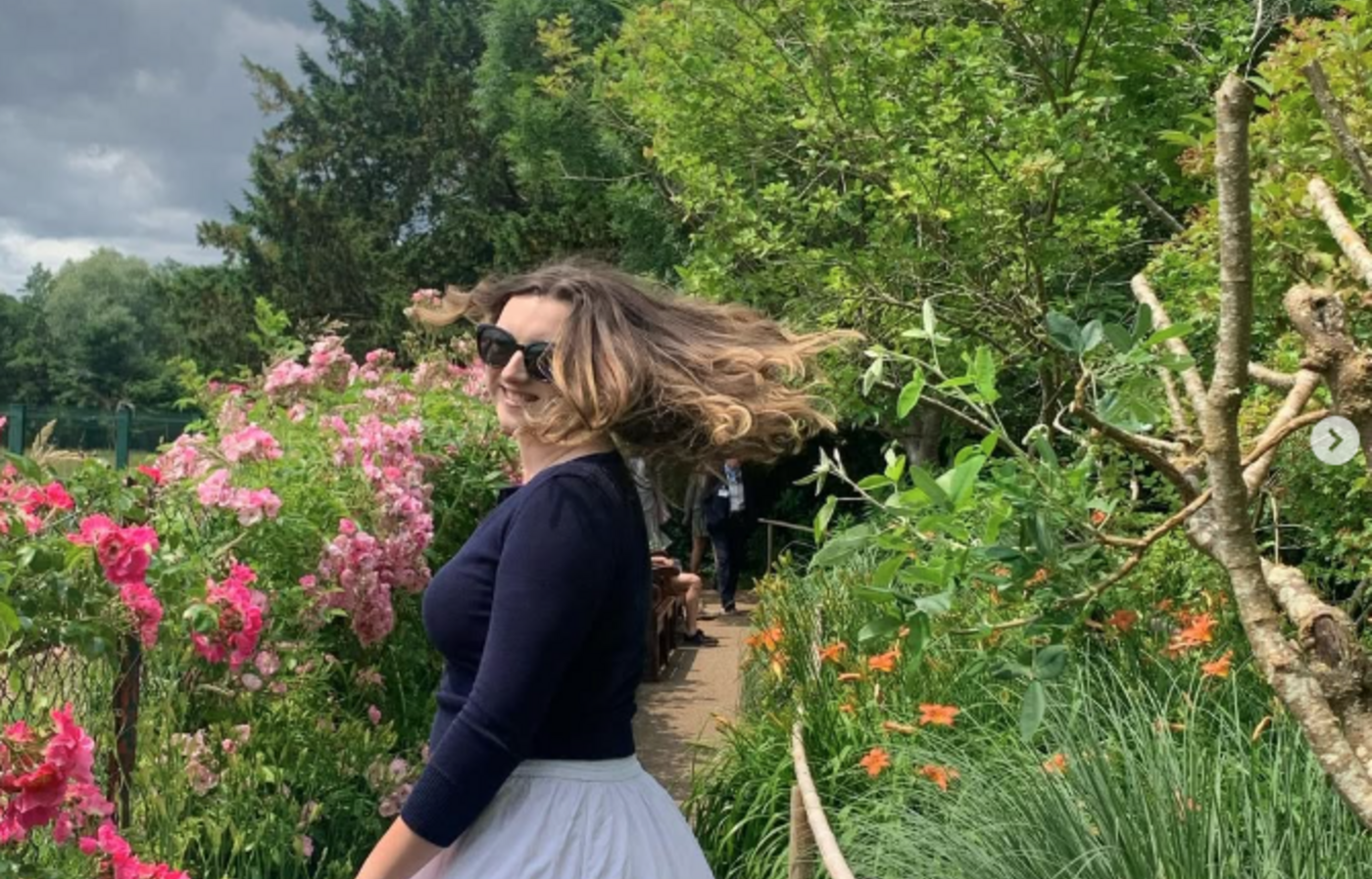 Kasey in a flower garden