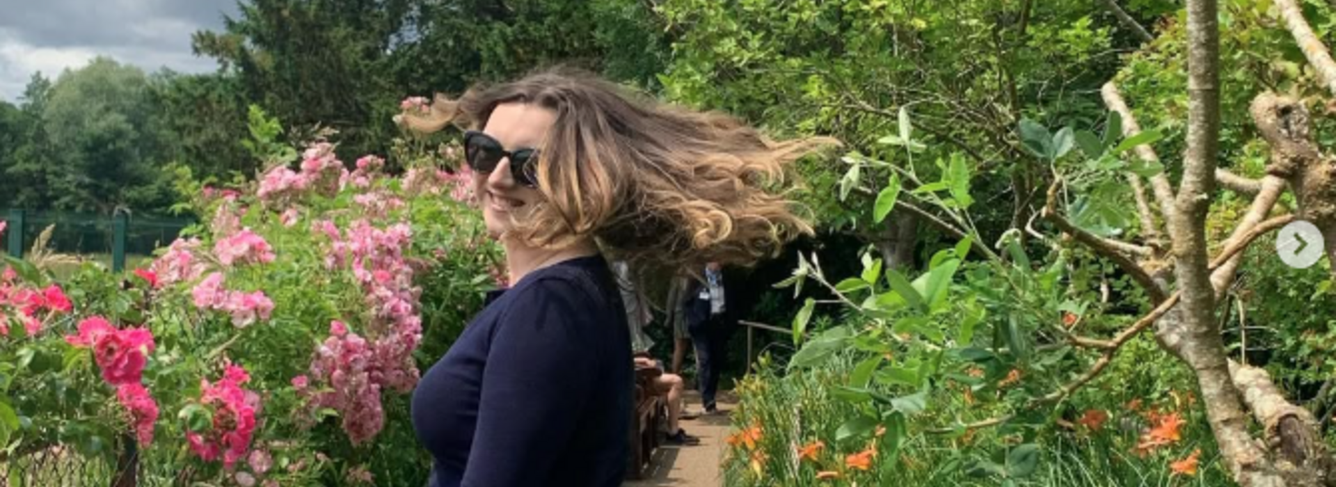Kasey in a flower garden